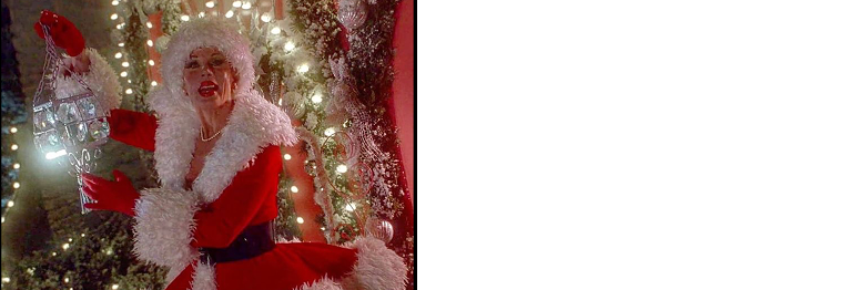 Martha May Who in front of her house decorated with Christmas lights.